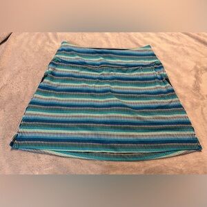 New Beautiful Adidas Skort multi colored blues, size small.